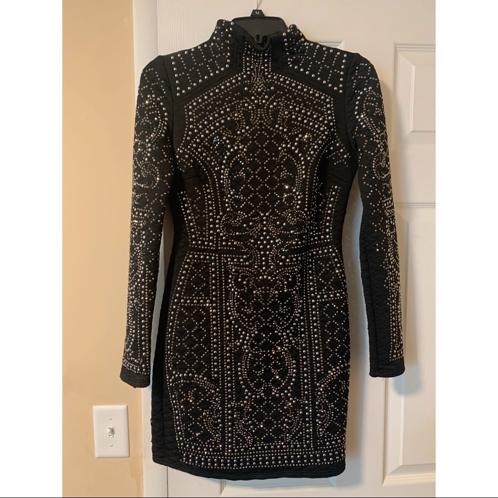 Long sleeve black dress.